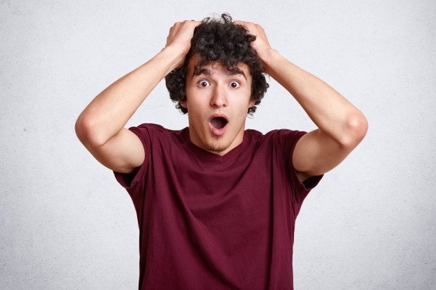 Close Up Portrait Astonished Young Man Keeps Hands Head 176532 8163